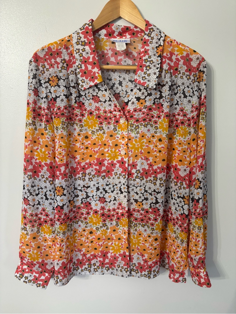 This is a vintage Blair multicolor floral button-up blouse